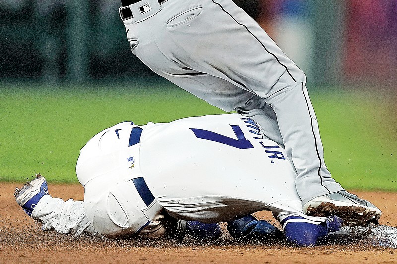 White Sox shortstop Leury Garcia falls on top of Bobby Witt Jr. of the Royals after Witt dove back to second base after a fly out by Kyle Isbel during the eighth inning of Tuesday night’s game at Kauffman Stadium in Kansas City. (Associated Press)