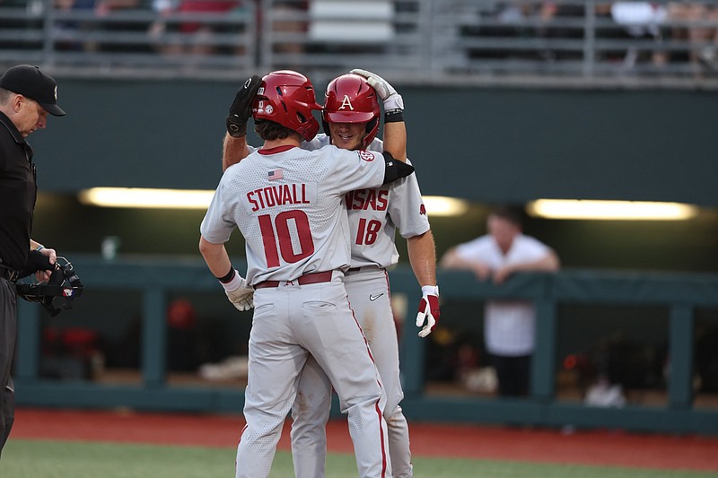 Arkansas’ Peyton Stovall (10) and teammate Chris Lanzilli celebrate after Stovall’s two-run home run in the fifth inning during the Razorbacks’ victory over Alabama on Thursday night in Tuscaloosa, Ala.
(Alabama Athletics Photography)