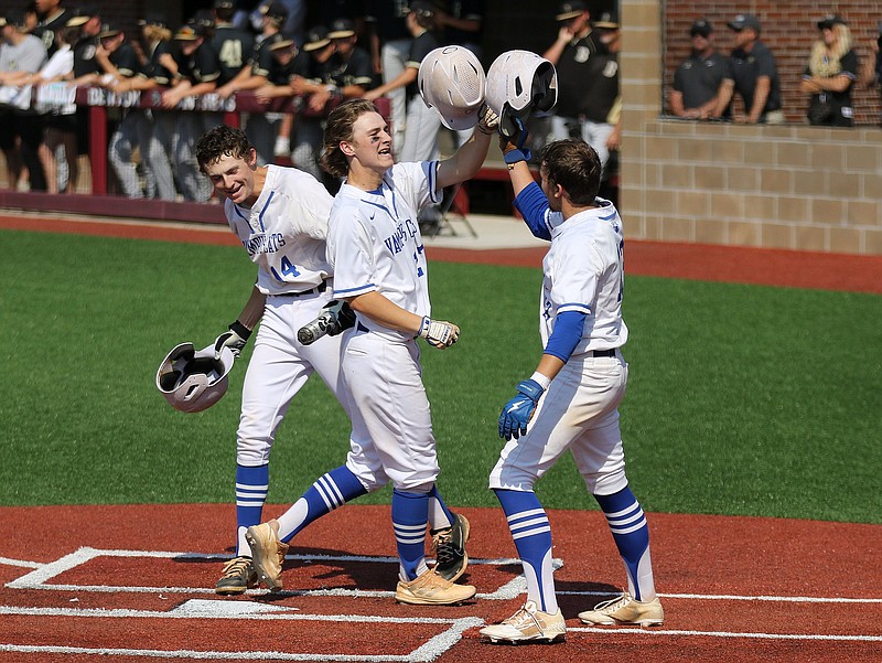 Will Thompson of Conway (27) celebrates with teammates Conner Cunningham (14) and Matthew Glover (13) after Thompson’s three-run home run in the bottom of the first inning of the Wampus Cats’ 10-7 victory over Bentonville in the Class 6A baseball state championship game Thursday at the Benton Athletic Complex. More photos at arkansasonline.com/520base6a/
(Arkansas Democrat-Gazette/Thomas Metthe)