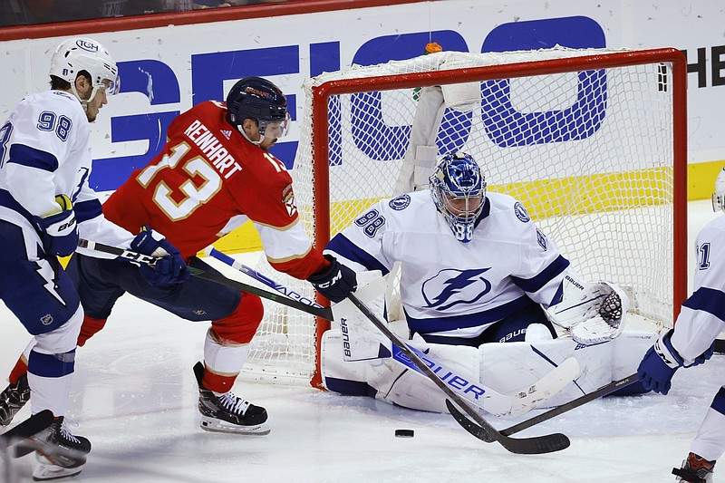 Tampa Bay goaltender Andrei Vasilevskiy (right) blocks a shot by Florida center Sam Reinhart (13) as defenseman Mikhail Sergachev watches during the third period of the Lightning’s 2-1 victory over the Panthers in Game 2 of their NHL Eastern Conference second-round series in Sunrise, Fla. Vasilevskiy finished with 34 saves.
(AP/Reinhold Matay)