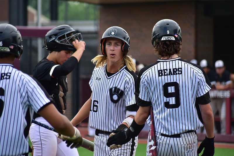 First baseman Owen Stover scores on a one-run single in the first inning as first baseman Dillon Butler welcomes him home in the 2A state high school baseball championship against Bigelow on Thursday, May 19, 2022, at Everett Field in Benton. (Pine Bluff Commercial/I.C. Murrell)
