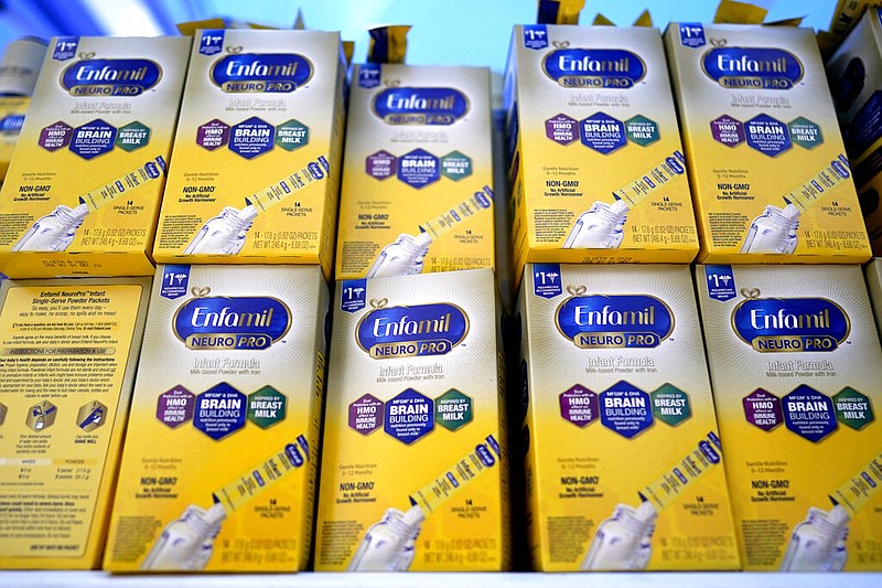 FILE - Infant formula is stacked on a table during a baby formula drive to help with the shortage May 14, 2022, in Houston. (AP/David J. Phillip, File)