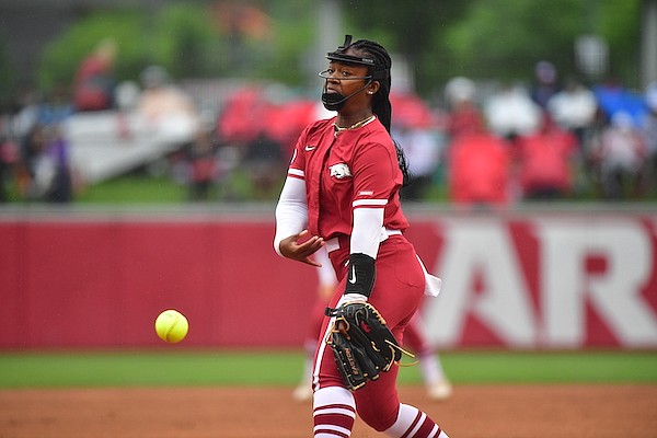 Arkansas' Chenise Delce pitches during an NCAA Tournament game against Oregon on Saturday, May 21, 2022, in Fayetteville.