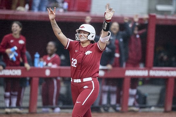 Arkansas' Linnie Malkin celebrates a home run during an NCAA Tournament game against Oregon on Saturday, May 21, 2022, in Fayetteville.