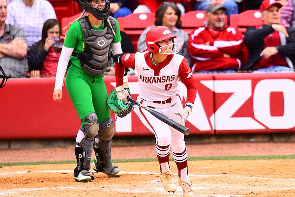 Arkansas' KB Sides hits a home run during the sixth inning of an NCAA Tournament game against Oregon on Sunday, May 22, 2022, in Fayetteville.