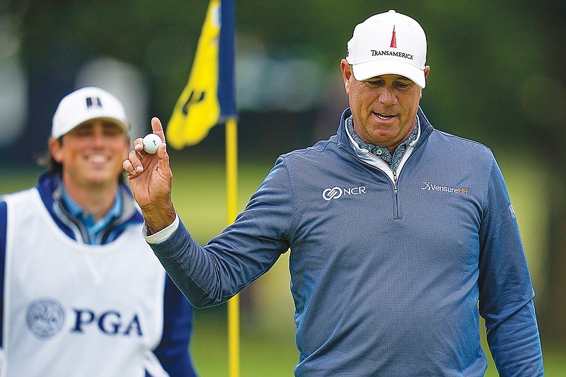 Stewart Cink waves after making a putt on the third hole during Saturday's third round of the PGA Championship at Southern Hills Country Club in Tulsa, Okla. (Associated Press)