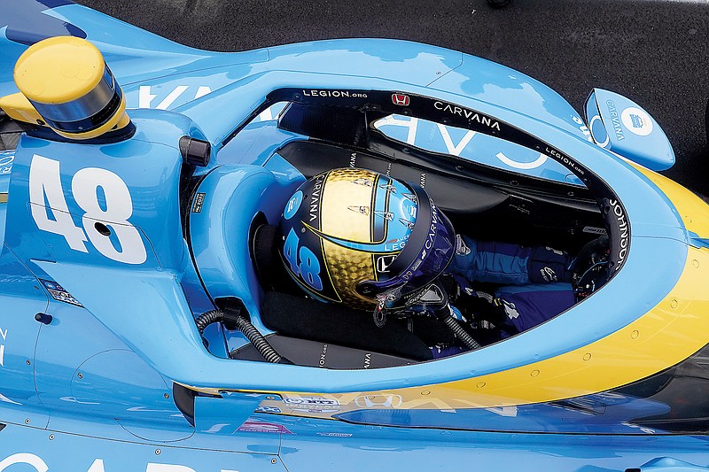 Jimmie Johnson sits in his car during qualifications Saturday for the Indianapolis 500 at Indianapolis Motor Speedway in Indianapolis. (Associated Press)