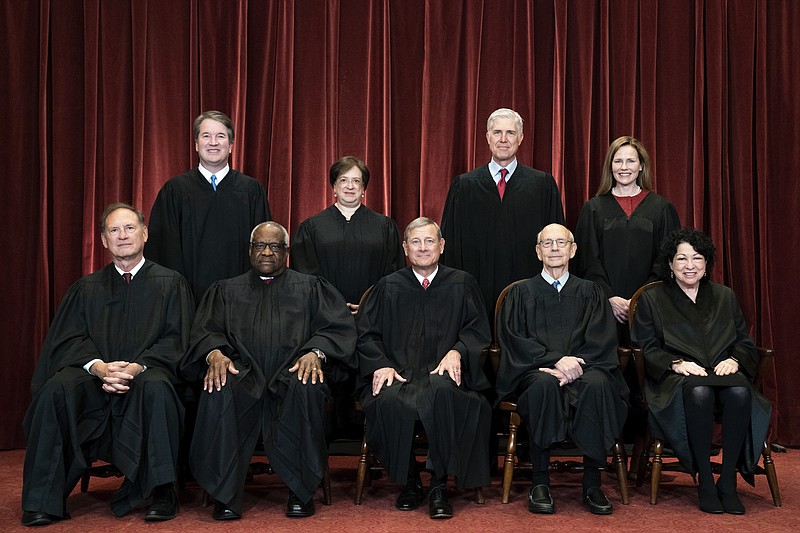 Members of the Supreme Court pose for a group photo at the Supreme Court in Washington, April 23, 2021. Seated from left are Associate Justice Samuel Alito, Associate Justice Clarence Thomas, Chief Justice John Roberts, Associate Justice Stephen Breyer and Associate Justice Sonia Sotomayor, Standing from left are Associate Justice Brett Kavanaugh, Associate Justice Elena Kagan, Associate Justice Neil Gorsuch and Associate Justice Amy Coney Barrett. In one form or another, every Supreme Court nominee is asked during Senate hearings about his or her views of the landmark abortion rights ruling that has stood for a half century. (Erin Schaff/The New York Times via AP, Pool, File)