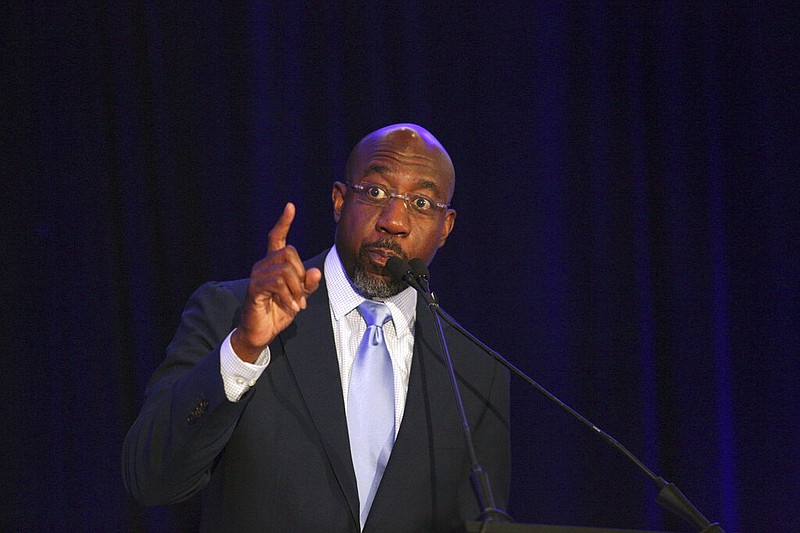 Sen. Raphael Warnock, D-Ga., addresses the Gwinnett County Democratic Party fundraiser on Saturday, May 21, 2022 in Norcross, Ga. (AP Photo/Akili-Casundria Ramsess)