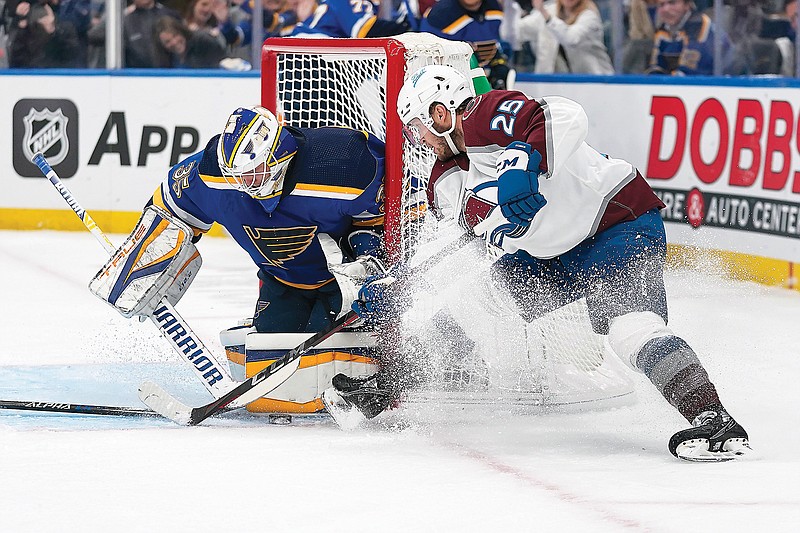 Blues goaltender Ville Husso stops a shot from Logan O'Connor of the Avalanche during the first period in Game 4 of Monday night's Western Conference second-round series at Enterprise Center in St. Louis. (Associated Press)