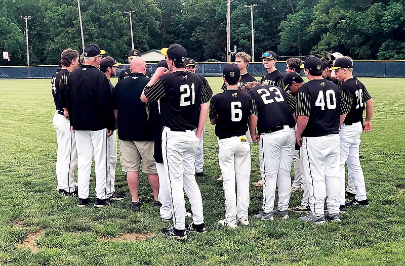 The St. Elizabeth Hornets huddle after Monday's 10-0 win against the Weaubleau Tigers in Class 1 sectional action in St. Elizabeth. (Tom Rackers/News Tribune)