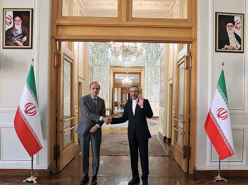 Enrique Mora, the European Union coordinator of talks to revive Iran’s nuclear accord with world powers (left), shakes hands with Iran’s top nuclear negotiator Ali Bagheri Kani Wednesday, May 11, in Tehran, Iran.
(AP/Iranian Foreign Ministry)