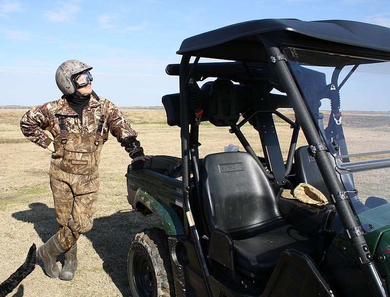 A side-by-side utility vehicle is a fun and useful off-road tool if drivers operate them responsibly. Wearing a helmet is a common sense insurance consideration.
(Arkansas Democrat-Gazette/Bryan Hendricks)