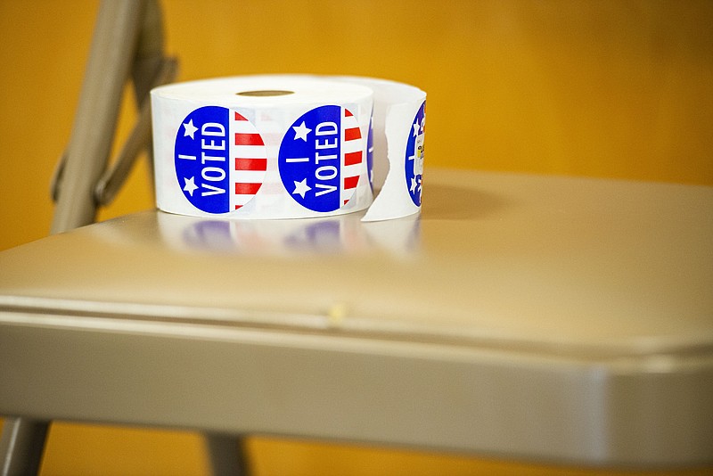 A roll of voting stickers is seen on Election Day, Tuesday, May 24, 2022, at the Elm Grove Community Center at Martin Luther King Jr. Park in Fort Smith. Voters in Sebastian County cast their ballots for several primary, county, city and school board races, as well as special tax elections. 
(NWA Democrat-Gazette/Hank Layton)