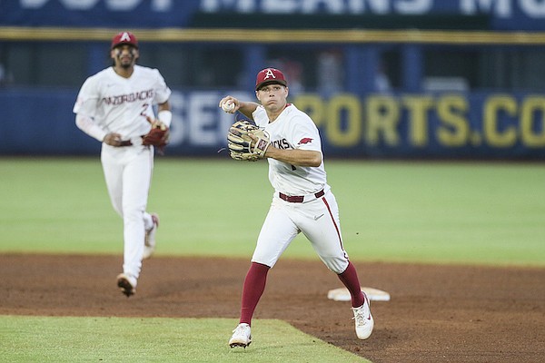 Arkansas second baseman Robert Moore throws during an SEC Tournament game against Alabama on Wednesday, May 25, 2022, in Hoover, Ala.
