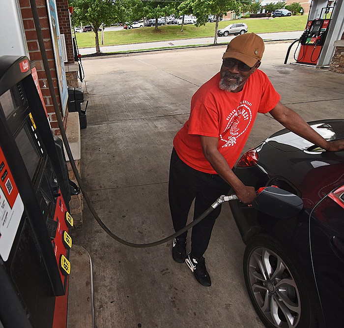 Cedrick McNair of North Little Rock fills up Thursday at the Casey’s store in North Little Rock. Gas prices in Arkansas have increased 39% from a year ago, when regular gasoline was generally going for $2.76 a gallon.
(Arkansas Democrat-Gazette/Staci Vandagriff)
