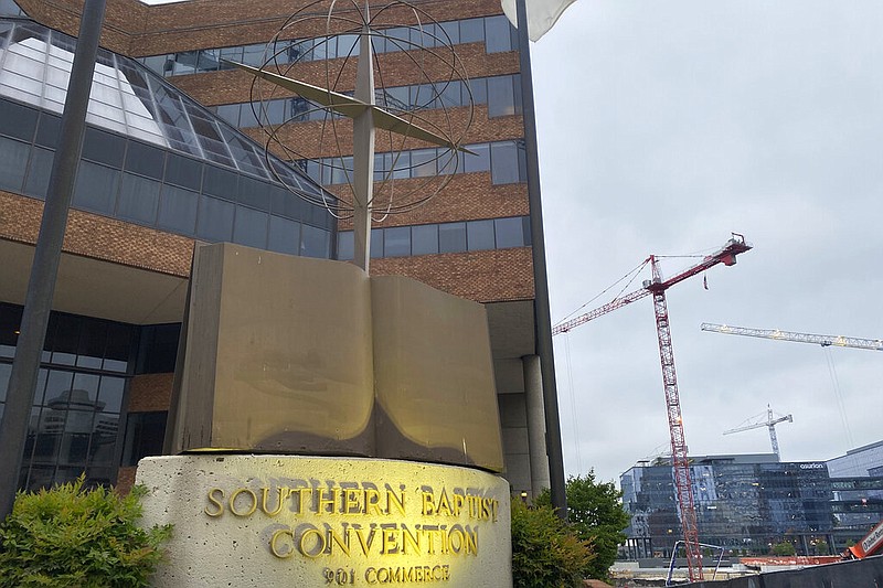 A cross and Bible sculpture stand outside the Southern Baptist Convention headquarters in Nashville, Tenn., on Tuesday, May 24, 2022. (AP/Holly Meyer)