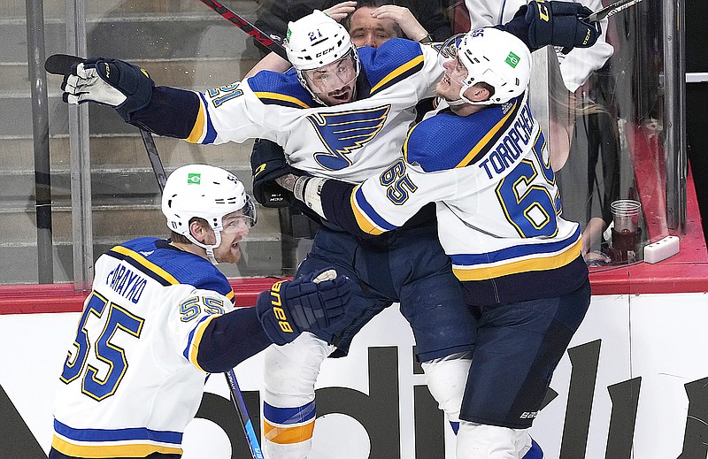 Tyler Bozak (center) celebrates his overtime goal with teammates Colton Parayko (left) and Alexei Toropchenko to end Wednesday night’s Game 5 of the Western Conference second-round series against the Avalanche in Denver. (Associated Press)