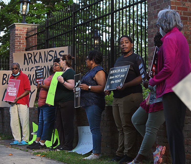 Members of Arkansas Renters United and tenants who are facing or have faced eviction gather in front of the Governor’s Mansion on Thursday to demand Gov. Asa Hutchinson stop refusing federal funds to assist renters.
(Arkansas Democrat-Gazette/Staci Vandagriff)