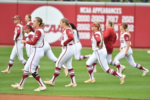 Arkansas players warm up on Thursday, May 26, 2022, ahead of the Razorbacks’ game against Texas in the Fayetteville Super Regional at Bogle Park in Fayetteville. Visit nwaonline.com/220527Daily/ for the photo gallery.