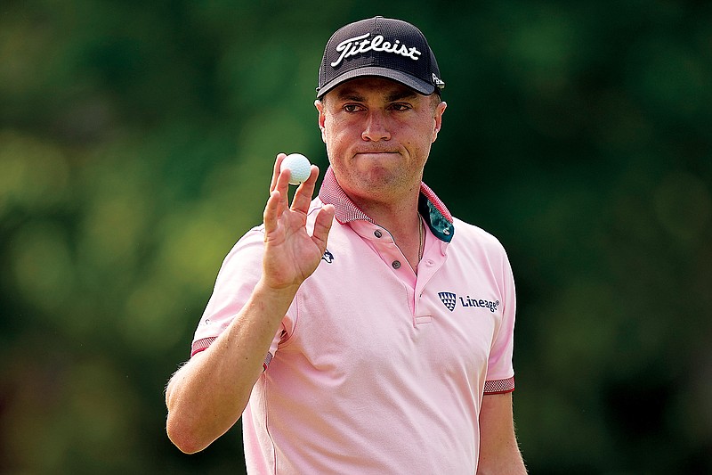 Justin Thomas waves to the fans after making a putt on the 14th hole during last Sunday’s final round of the PGA Championship at Southern Hills Country Club in Tulsa, Okla. (Associated Press)