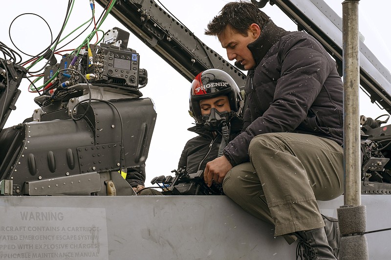 Hollywood superstar and famous perfectionist Tom Cruise consults with Monica Barbaro, who plays the Navy pilot Lt. Natasha “Phoenix” Trace on the set of “Top Gun: Maverick.”