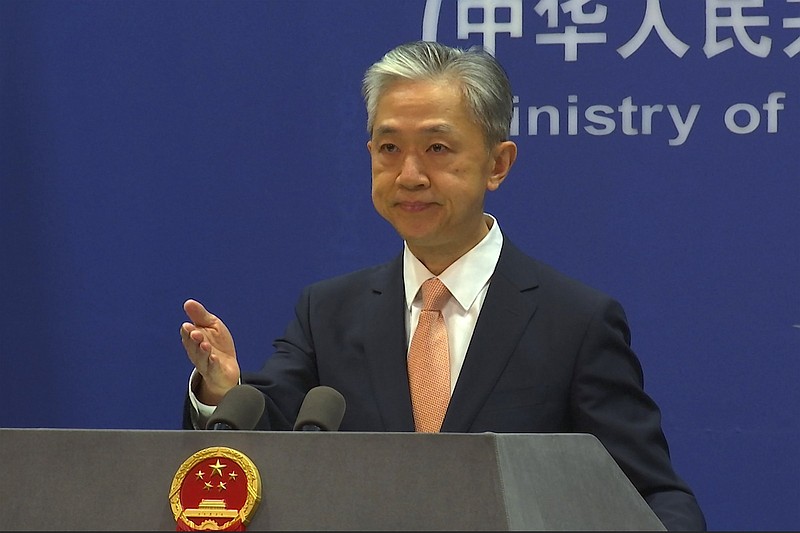 Chinese Foreign Ministry spokesperson Wang Wenbin reacts during the daily presser at the Ministry of Foreign Affiairs Friday in Beijing.
(AP/Liu Zheng)