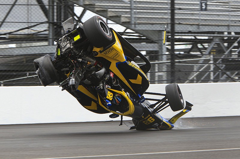 Colton Herta crashes in the first turn during the final practice for the Indianapolis 500 on Friday at Indianapolis Motor Speedway. Herta, who also blew an engine in qualifying, will start 25th and will race with a backup car for Sunday’s race.
(AP/Joe Watts)