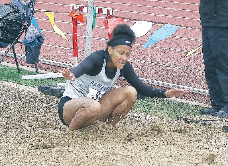 Kiara Strayhorn of Capital City lands in the sand on her final attempt in the girls long jump during the Class 5 track and field state championships last year at Adkins Stadium. (Greg Jackson/News Tribune)