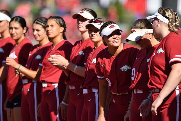 Arkansas players line up prior to an NCAA Tournament game against Texas on Friday, May 27, 2022, in Fayetteville.