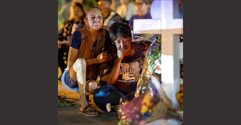 Relatives grieve for Alexandria Aniyah Rubio, 10, a victim of the mass shooting at Robb Elementary School, at a memorial in the town square in Uvalde, Texas, early Friday. More photos at arkansasonline.com/528uvalde/.
(The New York Times/Ivan Pierre Aguirre)