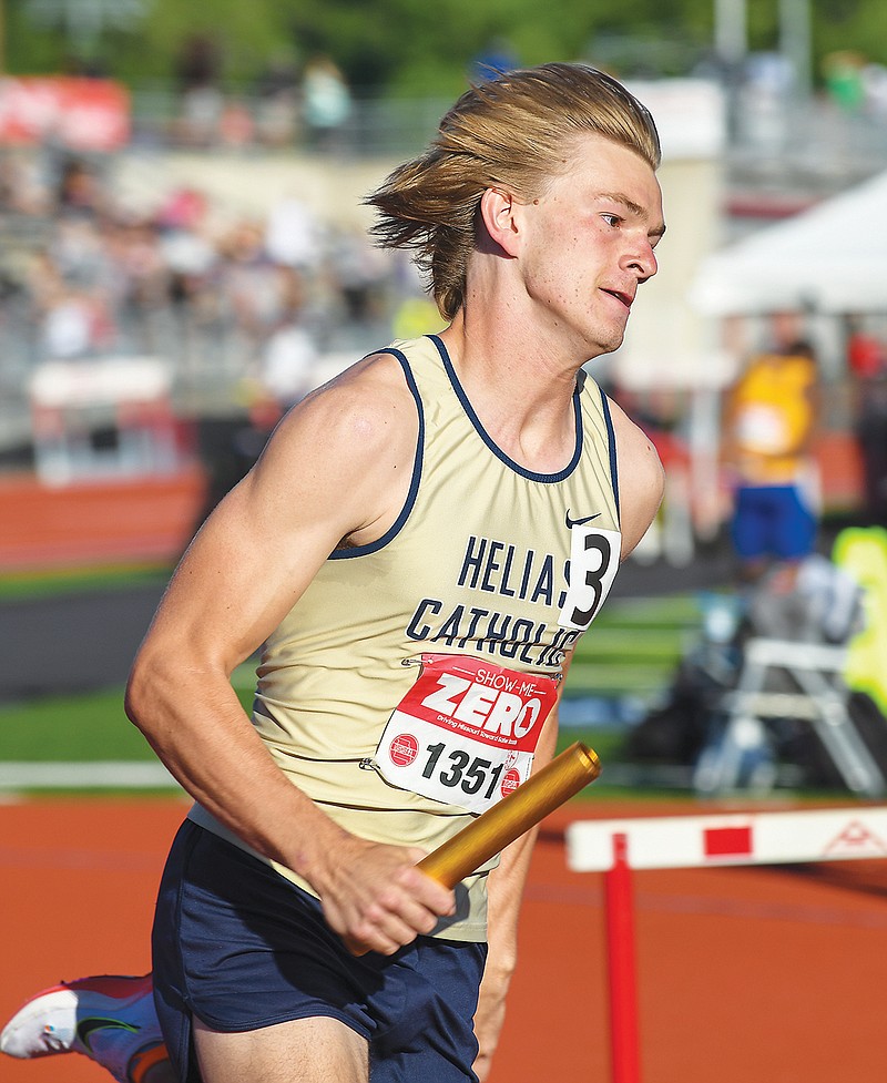 Noah Voss of Helias runs a leg in the 4x400-meter relay Friday in the Class 4 track and field state championships at Adkins Stadium. (Julie Smith/News Tribune)