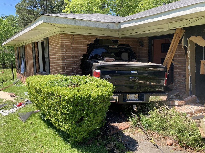 A pickup crashed into a house on Hazel Street on Saturday, hitting a children’s bedroom. Video at arkansasonline.com/529pickup/. 
(Pine Bluff Commercial/Byron Tate)