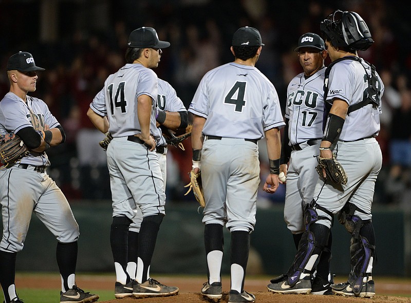 Grand Canyon coach Andy Stankiewicz speaks to his infield Tuesday, March 10, 2020, as he makes a pitching change during the fourth inning against Arkansas at Baum-Walker Stadium in Fayetteville. Visit nwaonline.com/200311Daily/ for today's photo gallery..(NWA Democrat-Gazette/Andy Shupe)
