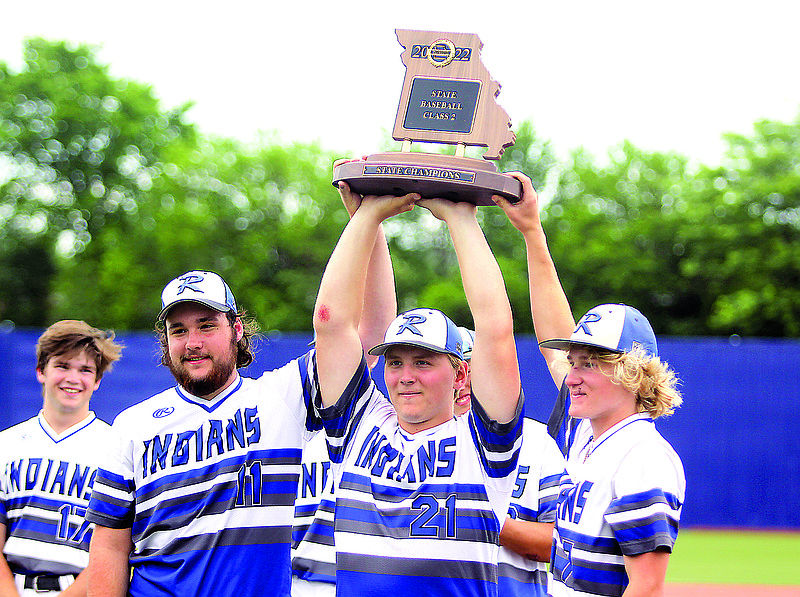 Greg Jackson/News Tribune.(From left) Russellville seniors Landen Waggoner, Logan Cinotto and Isaiah Kauffman hold up the Class 2 state champions plaque after the Indians beat Portageville 5-3 in Tuesday afternoon’s game at U.S. Ballpark in Ozark.