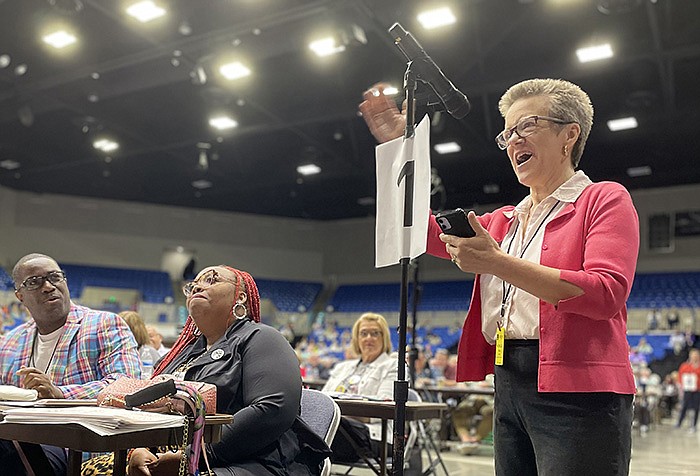 Rebekah Miles, a member of the Arkansas Annual Conference of the United Methodist Church and a professor at Perkins School of Theology, makes a motion Thursday to defer action on a proposal to make it easier for traditionalist congregations to break away without losing their property. The motion passed 366 to 270.
(Arkansas Democrat-Gazette/Frank E. Lockwood)