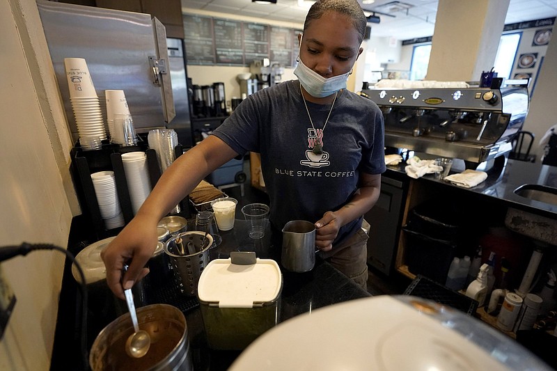 Barista Trinity Rucker, of Providence, R.I., makes a coffee drink at Blue State Coffee in Providence on Thursday. “The job market is the strongest it’s been since just after World War II,” President Joe Biden said Friday.
(AP/Steven Senne)