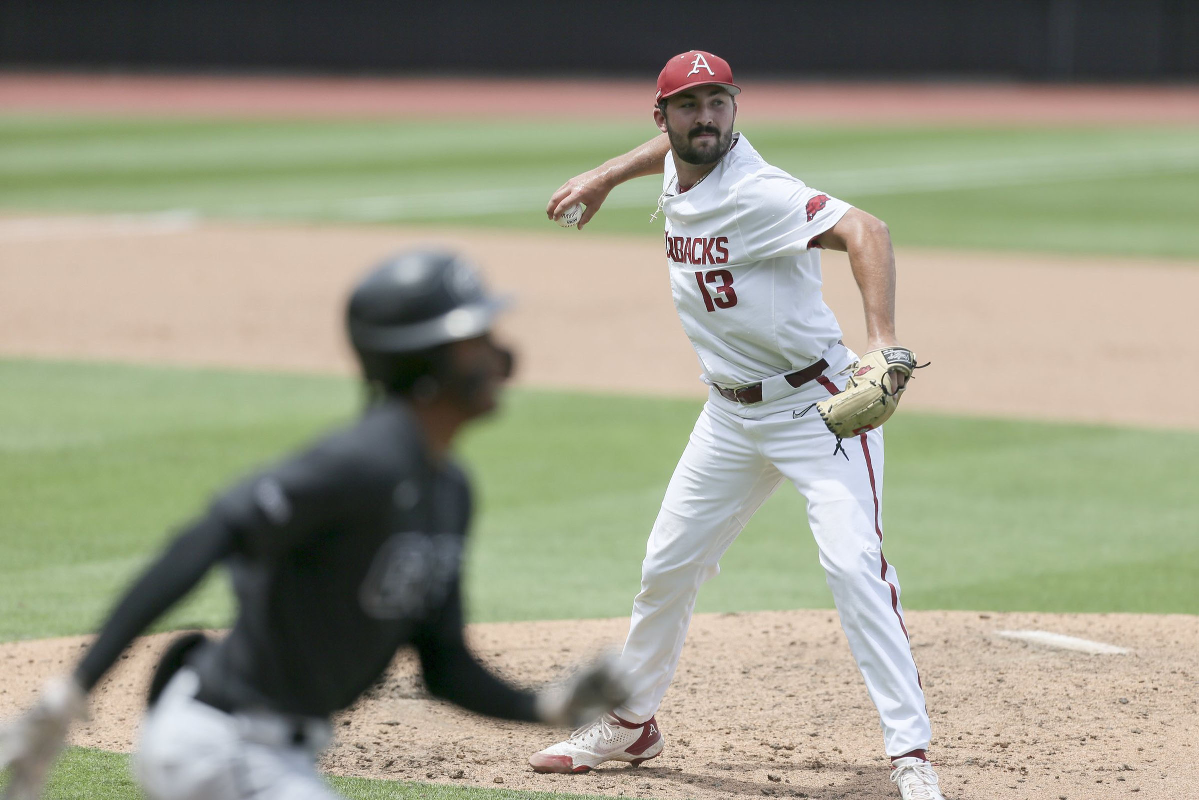 Former Razorback Kevin Kopps cheering hard for former team