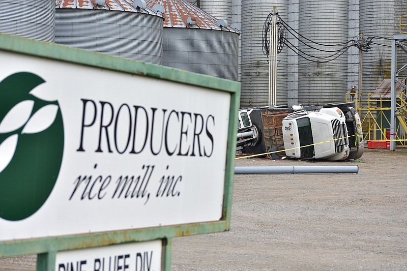 A truck-mounted crane toppled at the Producers Rice Mill on Kansas Street in Pine Bluff on Tuesday, killing a man. (Pine Bluff Commercial/I.C. Murrell)