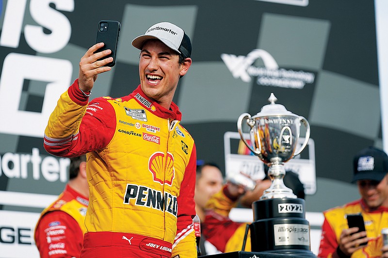 Joey Logano celebrates Sunday after winning the NASCAR Cup Series race at World Wide Technology Raceway in Madison, Ill. (Associated Press)