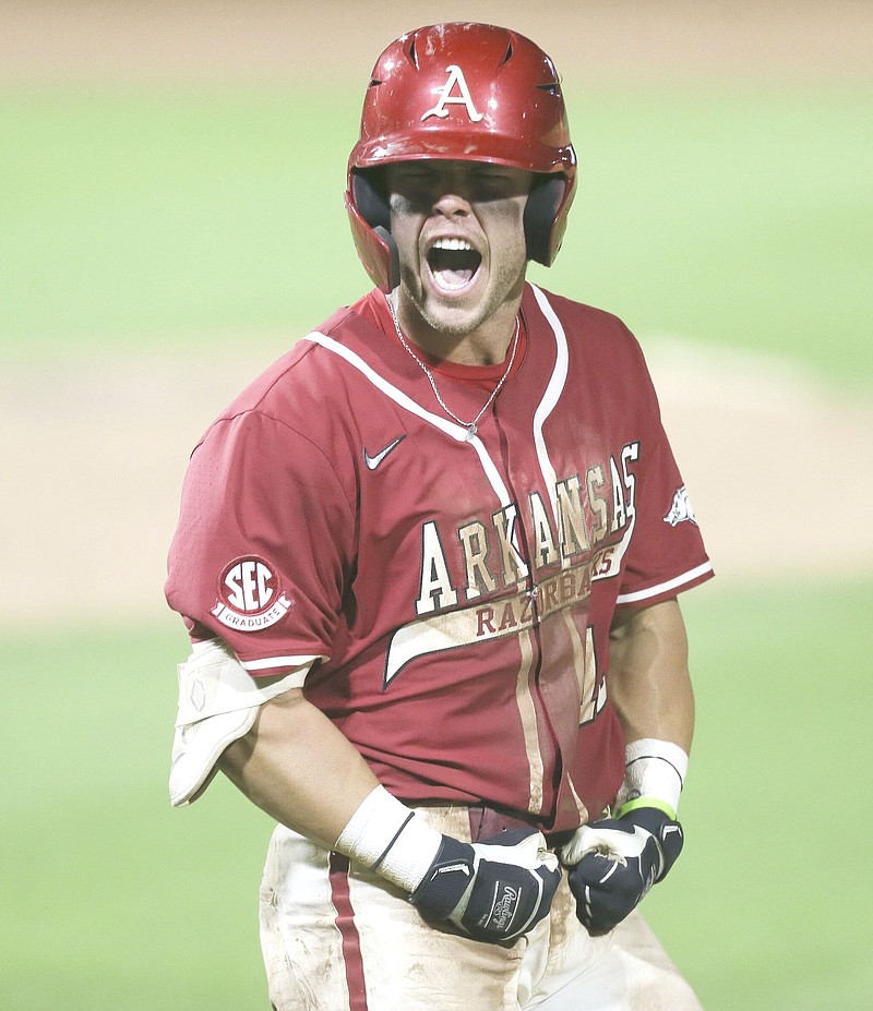 Arkansas Michael Turner (12) reacts as he runs home following a home-run, Sunday, June 5, 2022 during the eighth inning of the NCAA Baseball Stillwater Regional at O'Brate Stadium in Stillwater, Okla. Check out nwaonline.com/220606Daily/ and nwadg.com/photos for a photo gallery...(NWA Democrat-Gazette/Charlie Kaijo)