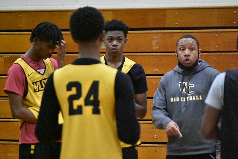 Watson Chapel Coach Marcus Adams (right) gives a scouting report as senior Jalyn Jones (second from right) and teammates listen at practice in March. 
(Pine Bluff Commercial/I.C. Murrell)