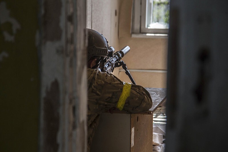 A Ukrainian soldier is in position during heavy fighting on the front line in Severodonetsk, the Luhansk region, Ukraine, Wednesday, June 8, 2022. (AP/Oleksandr Ratushniak)