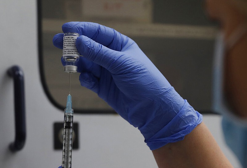 FILE - A vial of the Phase 3 Novavax coronavirus vaccine is seen ready for use in the trial at St. George's University hospital in London, Oct. 7, 2020. (AP/Alastair Grant, File)