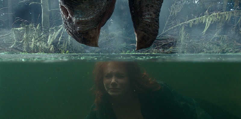 Water world: Former park operations manager Claire Dearing (Bryce Dallas Howard) attempts to escape the jaws of some ferocious prehistoric beast (that may or may not be an Indominus Rex) that has been resurrected through human folly in “Jurassic World Dominion,” allegedly the final film in the Jurassic Park saga.