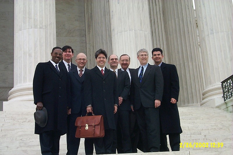 Paul Polidoro (holding satchel), the rest of the Jehovah’s Witnesses’ legal team and U.S. branch representatives, pose for a picture in front of the U.S. Supreme Court on the day the justices heard their challenge of a Stratton, Ohio ordinance. To the left of Polidoro is Phillip Brumley, the church’s current general counsel.
(Courtesy photo)