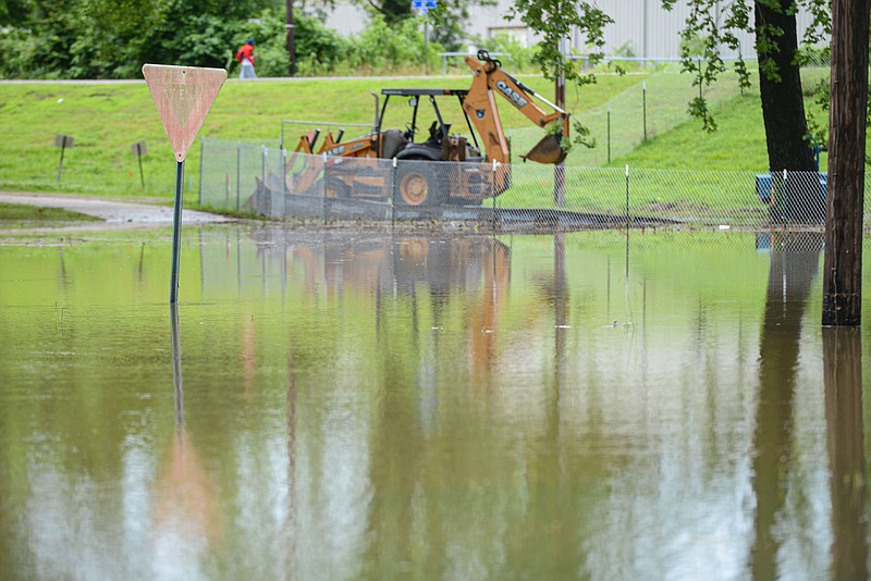Flood waters are seen on Friday, June 10, 2022, near a construction site at Fort Smith Park in Fort Smith. 
(NWA Democrat-Gazette/Hank Layton)