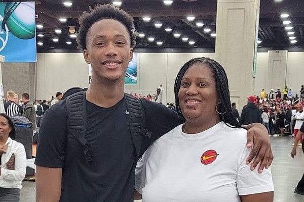 Tarasha Holland (right) and her son Ron Holland are taking the recruitment process one step at a time. Ron, who is from Duncanville, Texas, narrowed his list of possible schools to include Arkansas.