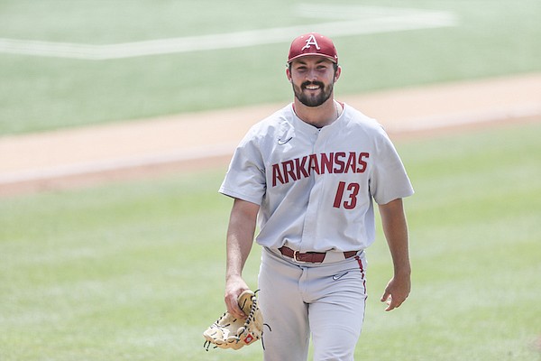 Arkansas pitcher Connor Noland returns to the dugout following the first inning of an NCAA Tournament game against North Carolina on Saturday, June 11, 2022, in Chapel Hill, N.C.