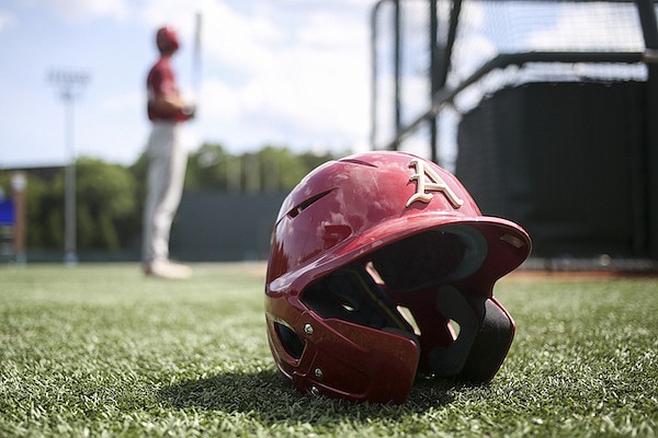 An Arkansas helmet sits on the field during practice Friday, June 10, 2022, in Chapel Hill, N.C.